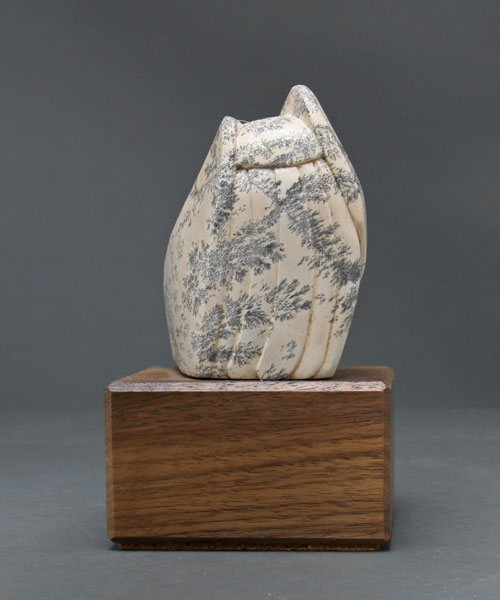 A view of the back of the dendritic Soapstone Owl #18F by Clarence P. Cameron of Madison, Wisconsin