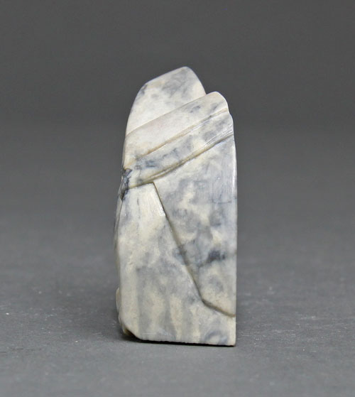 A side view of Soapstone Owl #6 by Clarence P. Cameron