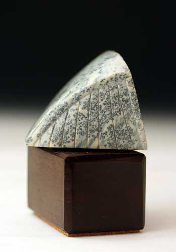 A view of the tail  of Soapstone Owl #16C