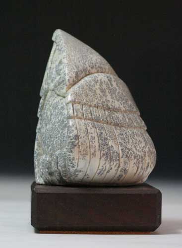 A larger image of one face on Soapstone Owl #13 by Clarence P. Cameron