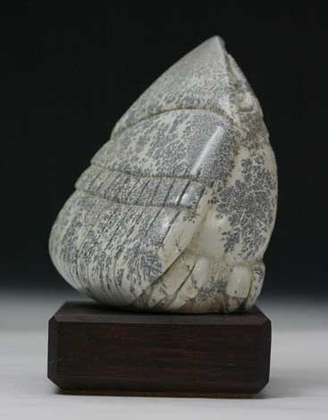 A view of the other face on Soapstone Owl #13 by Clarence P. Cameron