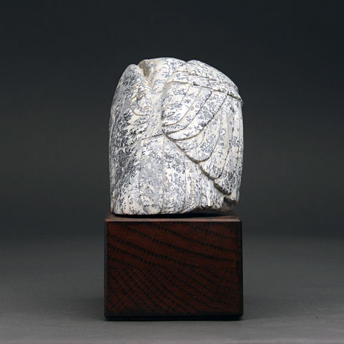 A view of the back of Soapstone Owl #12F