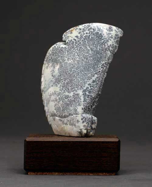 A view of the back of Soapstone Owl #3C by Clarence P. Cameron